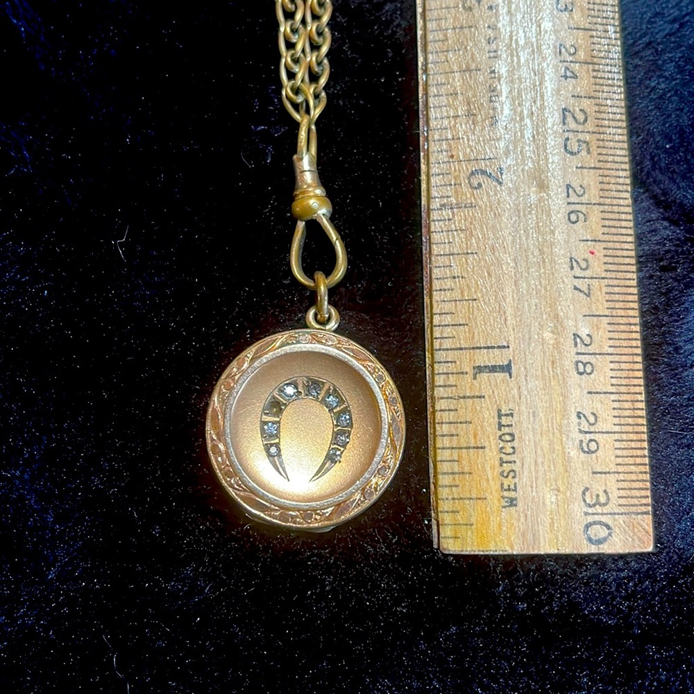 Antique horseshoe locket on old watch chain